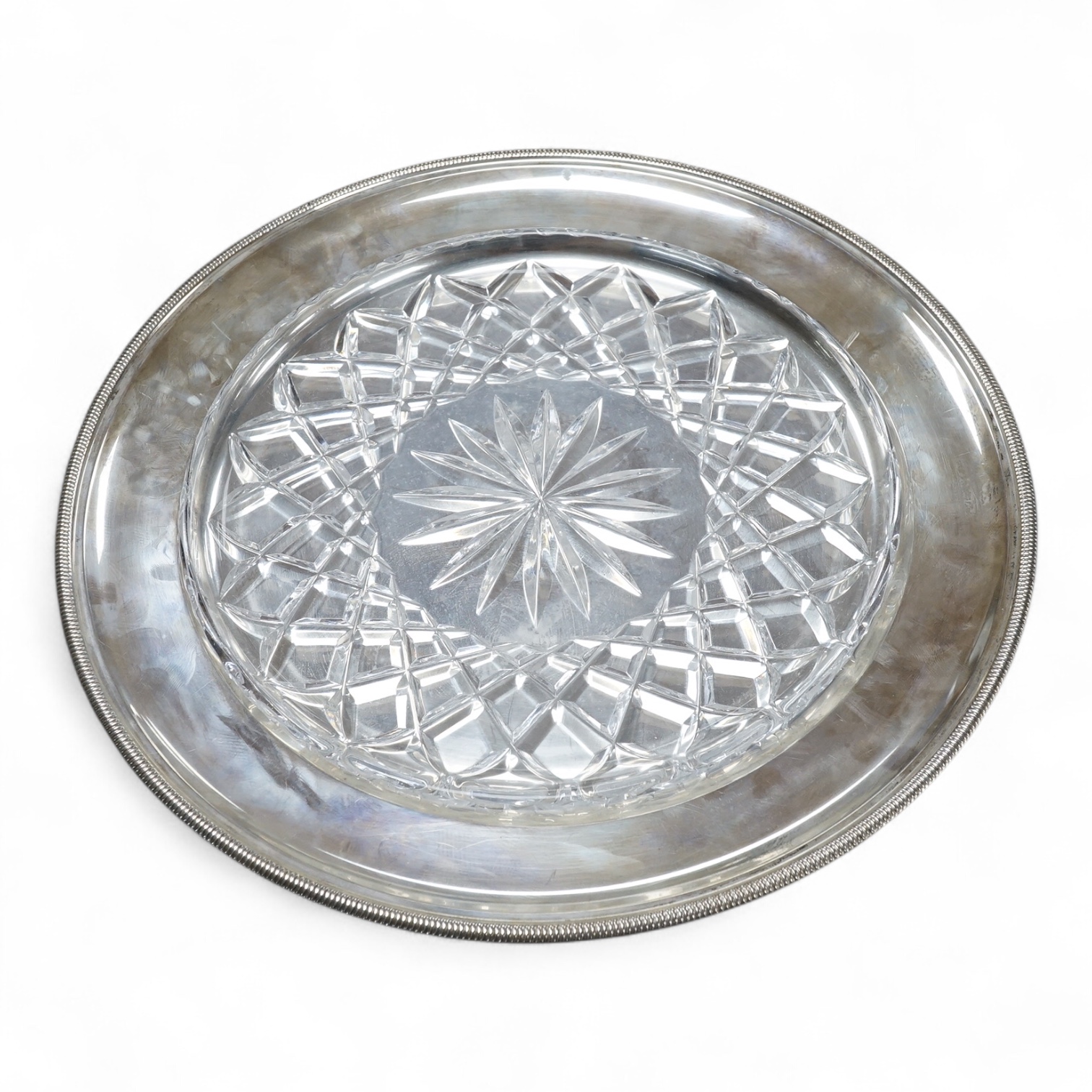 An Italian 800 standard white metal shallow plate with glass insert diameter 30.2cm, together with two Austro-Hungarian 800 standard white metal shaped oval dishes, 40.1oz.
